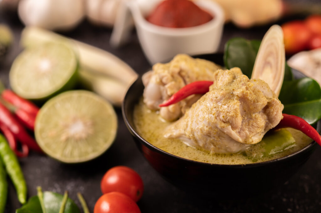chicken, chili, and basil, with tomato, lime, kaffir lime leaves and garlic.
